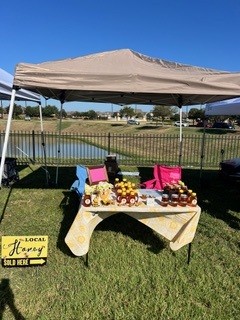 Bee Stellar's local market stand, proudly showcasing our locally harvested raw honey